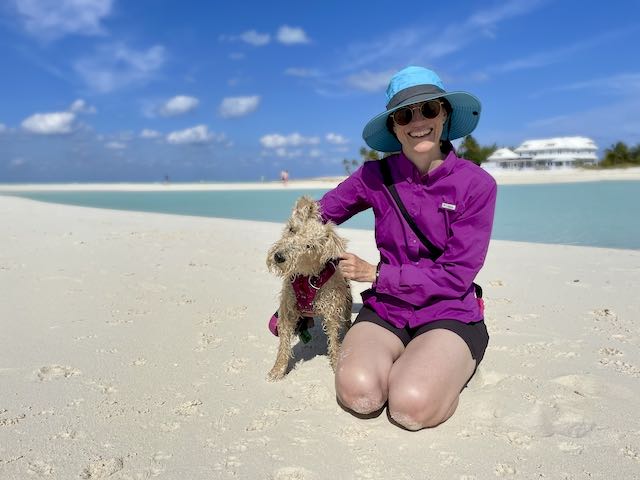 girl and dog on bahamas becah